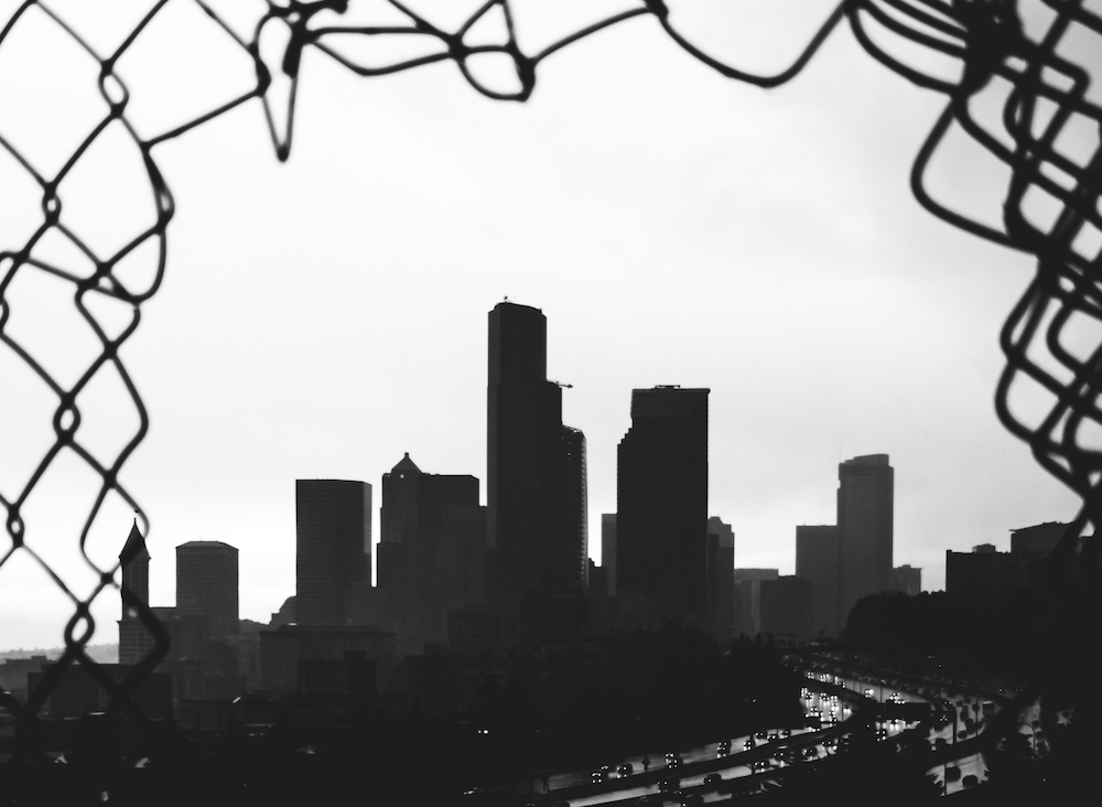 Seattle skyline black & white through a fence